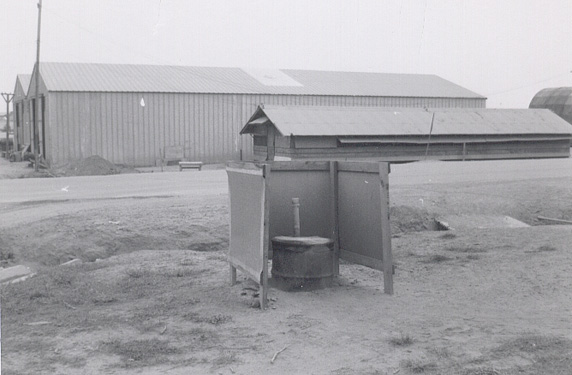 (42)  Toilet facility behind the avionics shop just before crossing the main road to the flightline.