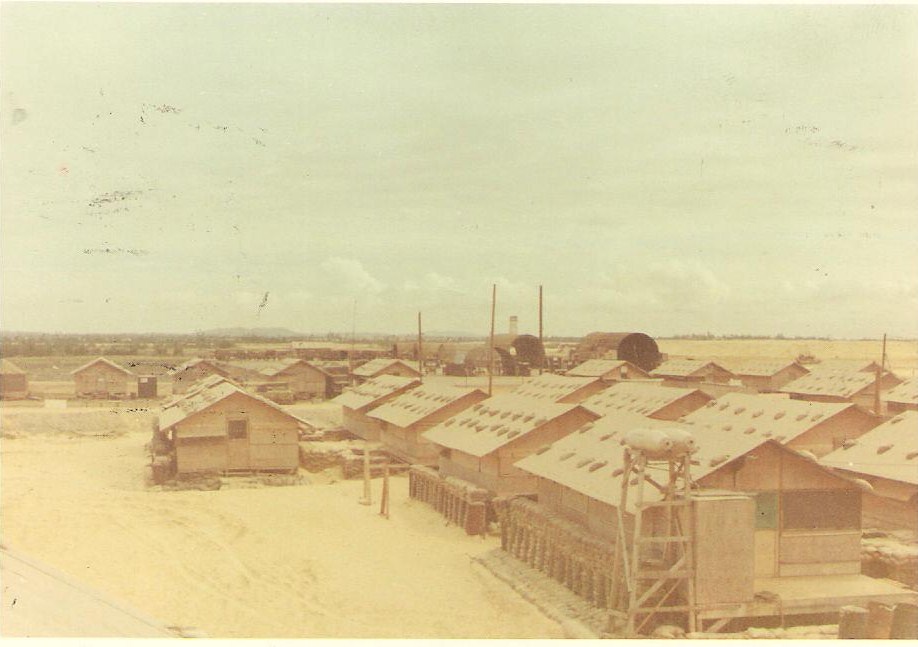 (028) Company area at the beach complex.  Enlisted hooches in the foreground; in the background, the flight line is on the left and the maintenance area towards the right.